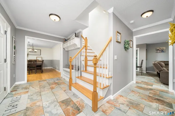 a view of a bedroom with furniture and entryway