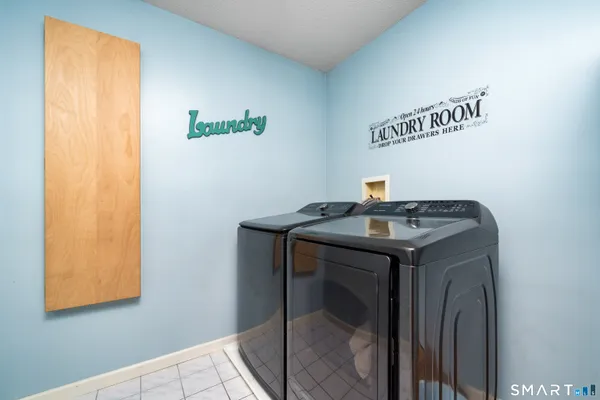 a utility room with a window and a sink