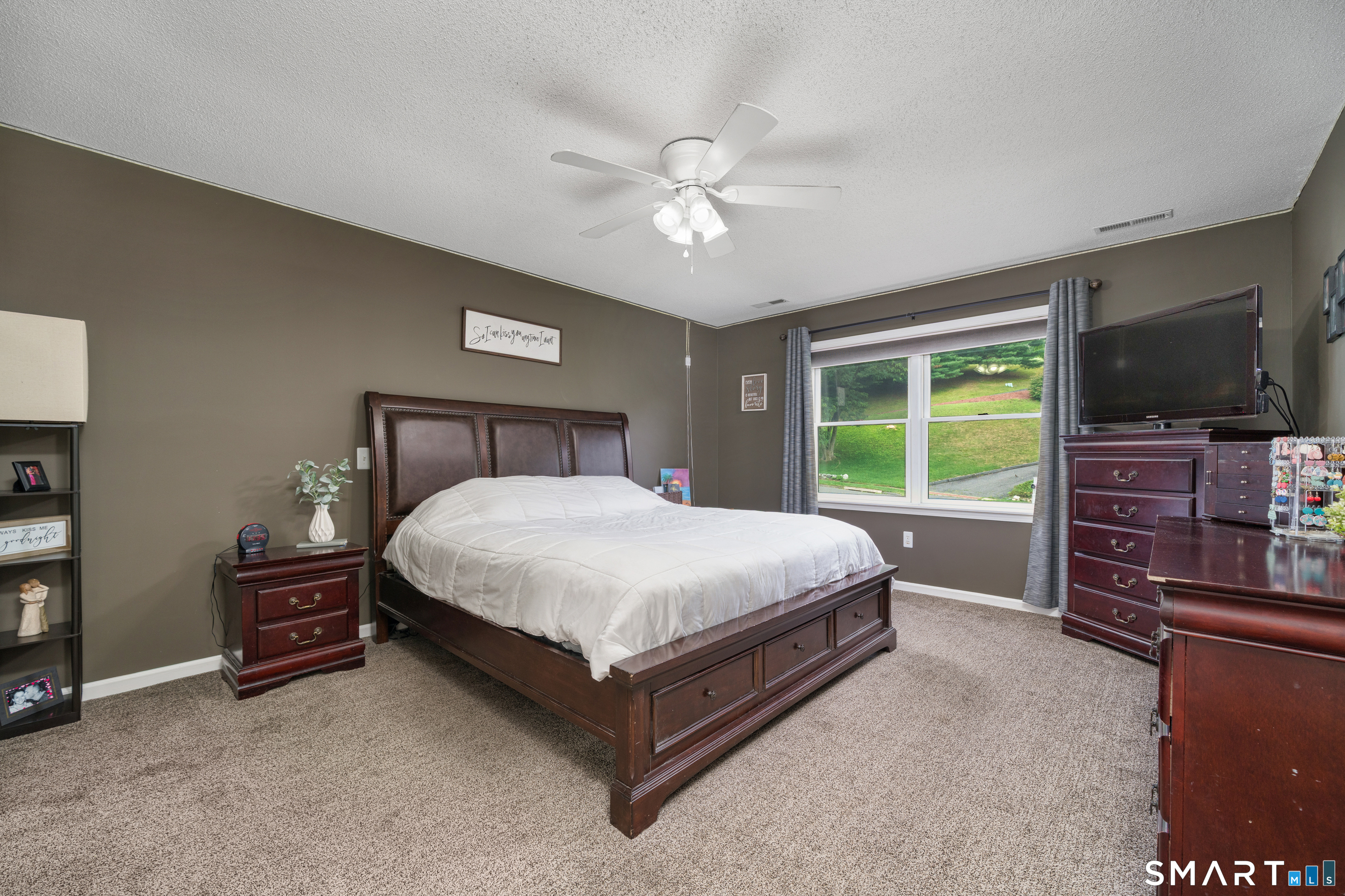 85 Wildewood Run Bristol, CT 06010 - Photo 19 of 29 a bedroom with a bed and a television on desk
