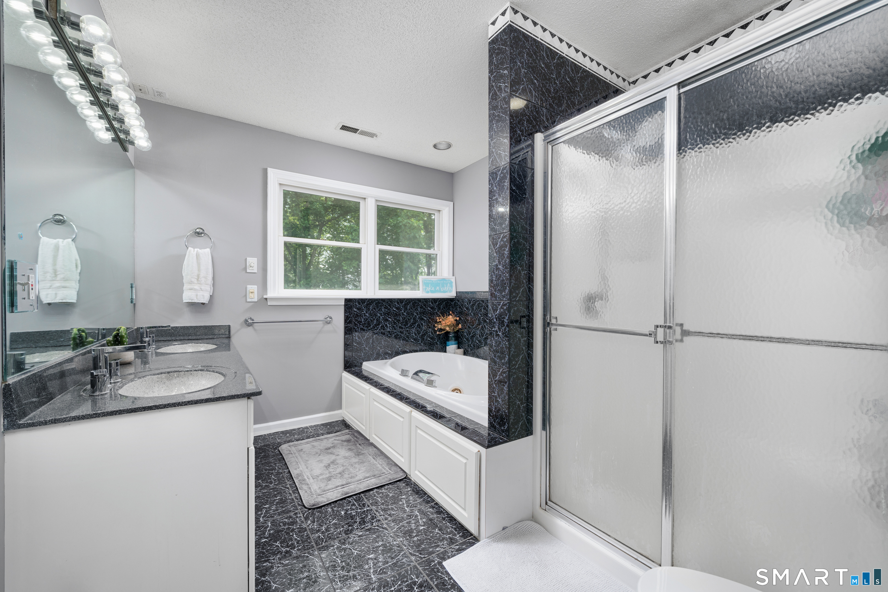 85 Wildewood Run Bristol, CT 06010 - Photo 21 of 29 a bathroom with a tub sink and mirror