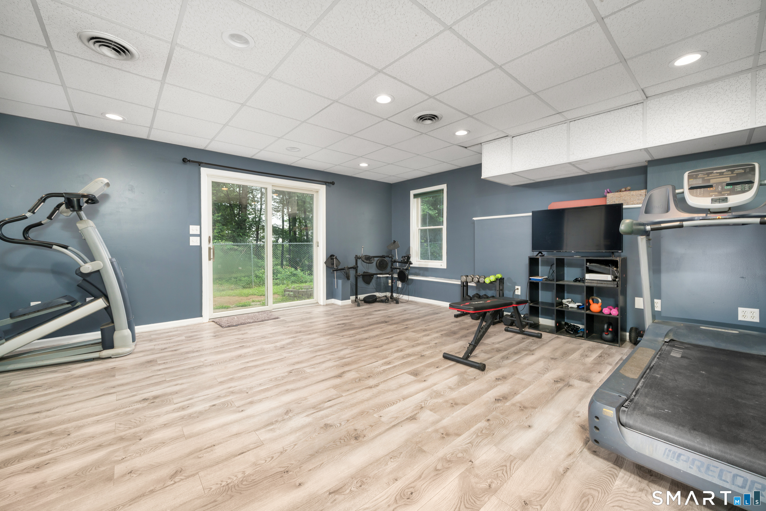 85 Wildewood Run Bristol, CT 06010 - Photo 23 of 29 a view of a room with gym equipment and a large window