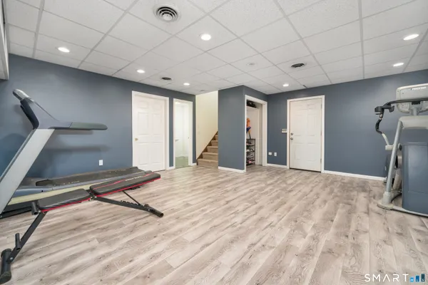 a view of a hall with a gym equipment