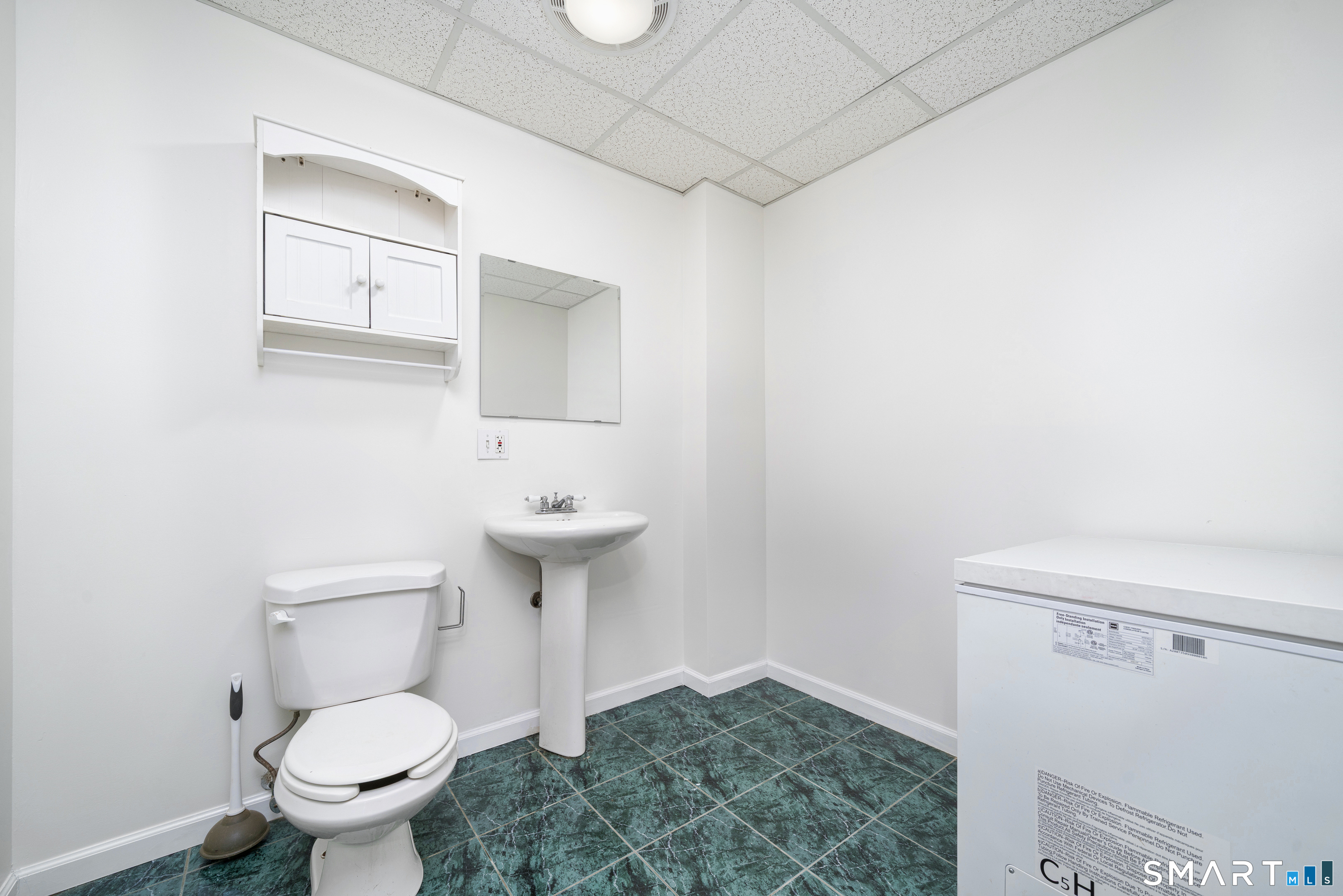85 Wildewood Run Bristol, CT 06010 - Photo 25 of 29 a bathroom with a sink a toilet and a mirror