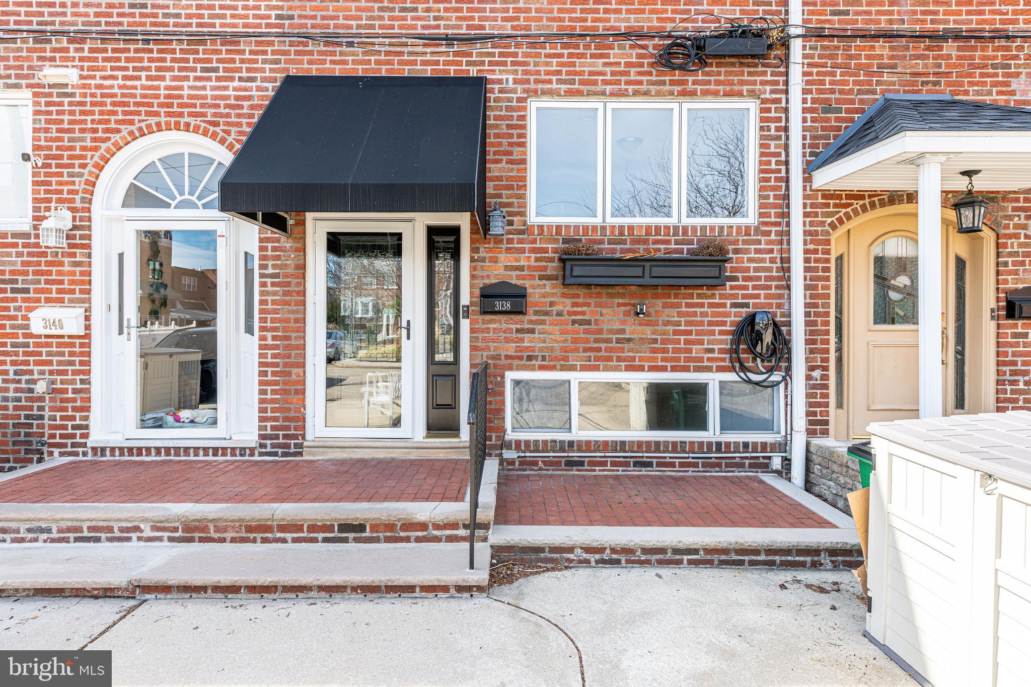 3138 Olympia Place Philadelphia, PA 19145 - Photo 3 of 24 New front door - new awning - VERY well-maintained