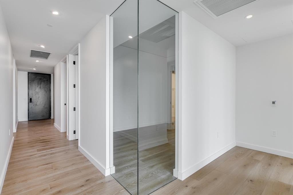 610 Davis Street, Unit 4201 Austin, TX 78701 - Photo 15 of 40 Corridor with recessed lighting and light wood finished floors