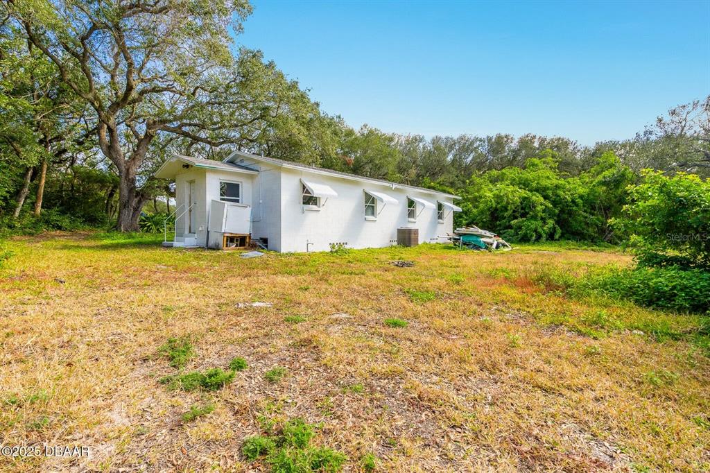 4770 South Peninsula Drive Ponce Inlet, FL 32127 - Photo 5 of 14 a view of a house with a yard