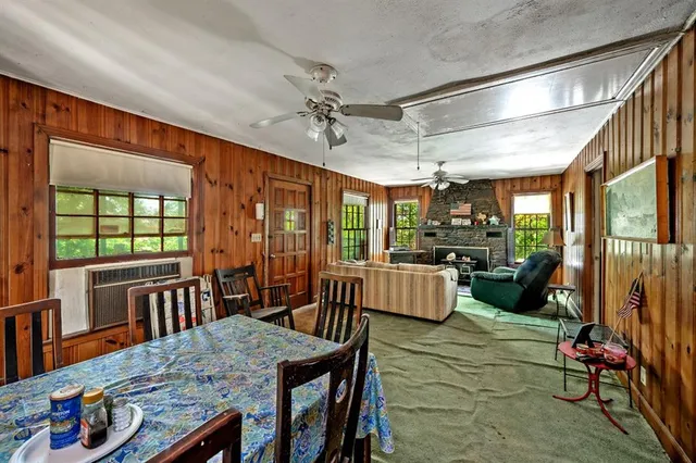 a view of a dining room with furniture window and outside view