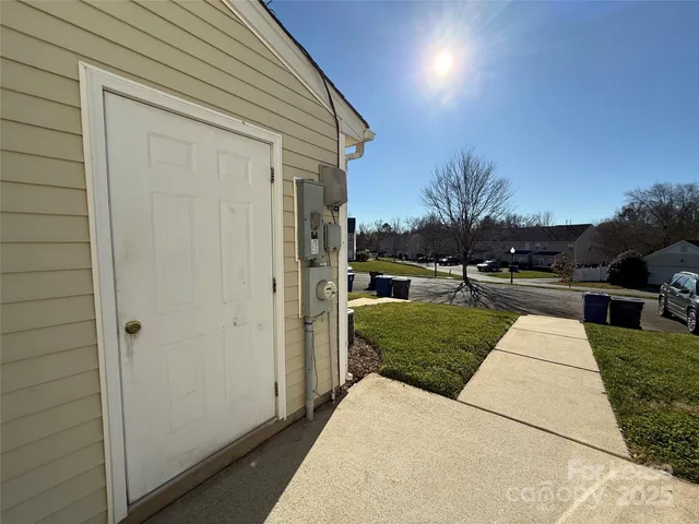 a view of a patio with a yard