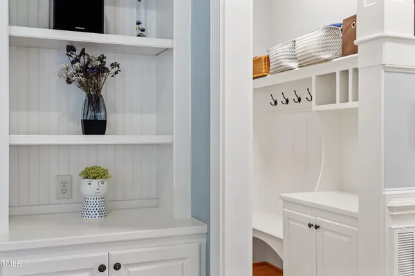 a bathroom with a granite countertop tub toilet a sink and a large mirror