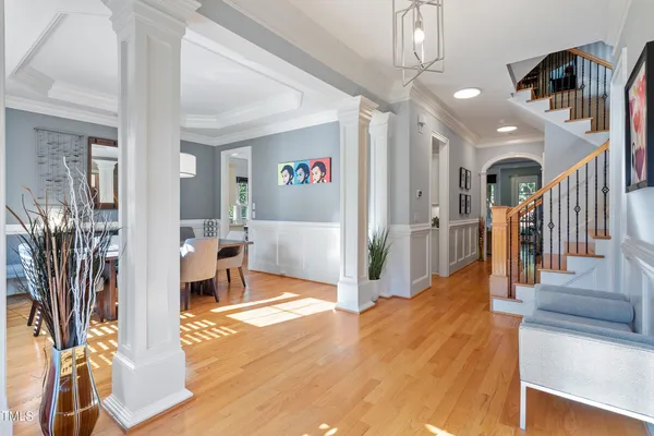 a view of entryway and hall with wooden floor