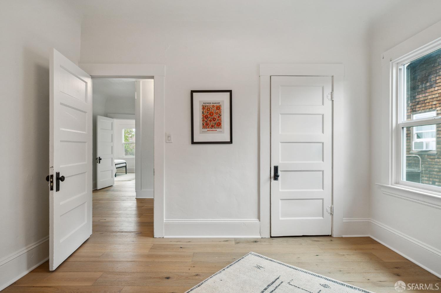 1800 Blake Street Berkeley, CA 94703 - Photo 28 of 58 a view of a hallway with wooden floor and windows