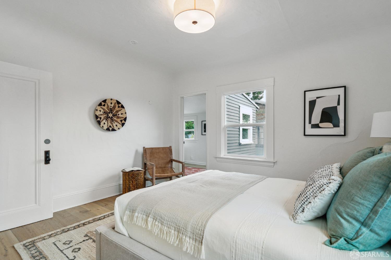 1800 Blake Street Berkeley, CA 94703 - Photo 35 of 58 a bedroom with a bed and a lamp on dresser