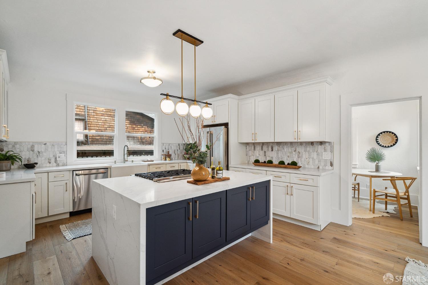 1800 Blake Street Berkeley, CA 94703 - Photo 40 of 58 a kitchen with white cabinets appliances and wooden floor