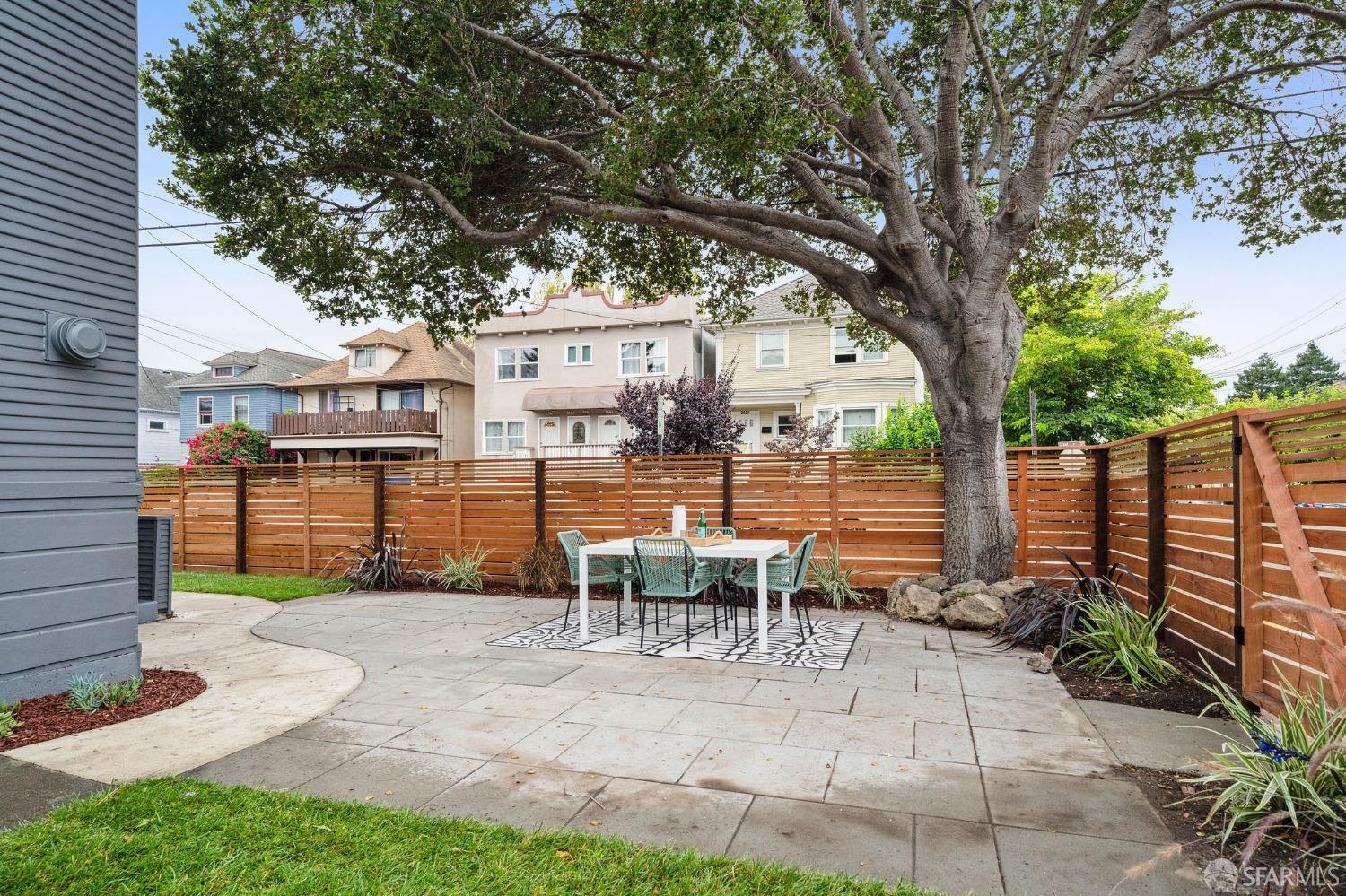 1800 Blake Street Berkeley, CA 94703 - Photo 54 of 58 a view of a patio with table and chairs potted plants and large tree