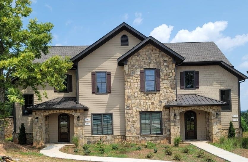 a front view of a house with garden