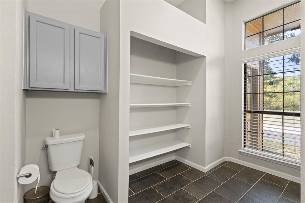 420 Seminary Ridge Mesquite, TX 75149 - Photo 14 of 36 a white toilet sitting next to a window