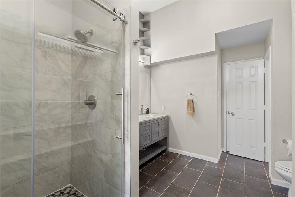 420 Seminary Ridge Mesquite, TX 75149 - Photo 15 of 36 a bathroom with a shower and a sink