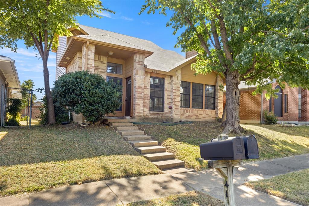 420 Seminary Ridge Mesquite, TX 75149 - Photo 2 of 36 a view of a house with backyard and a tree