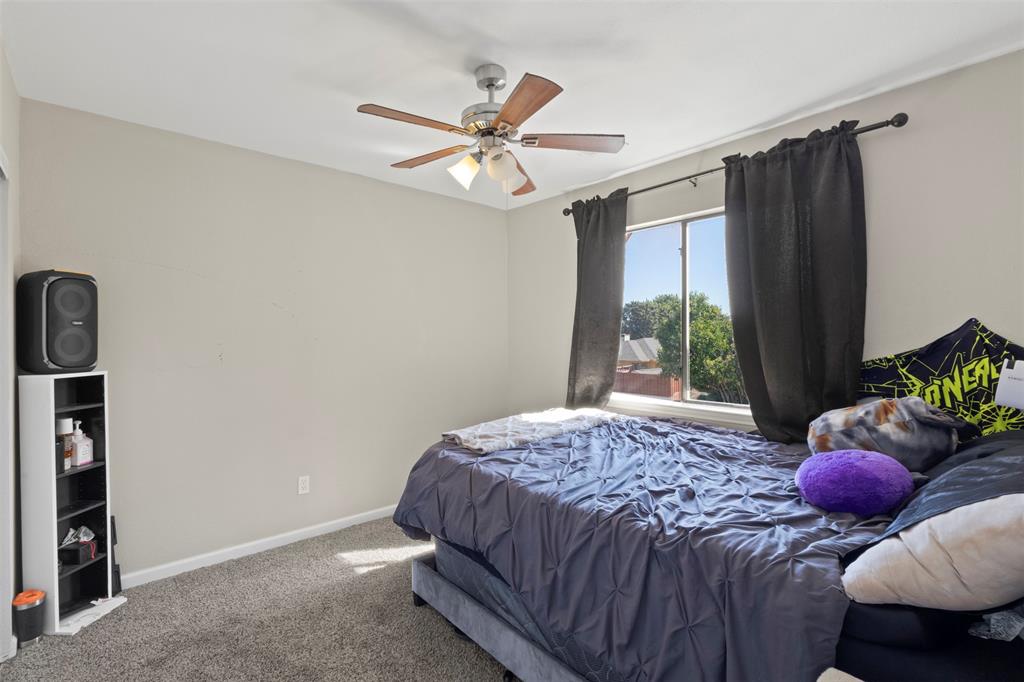 420 Seminary Ridge Mesquite, TX 75149 - Photo 23 of 36 a bedroom with a bed and a window