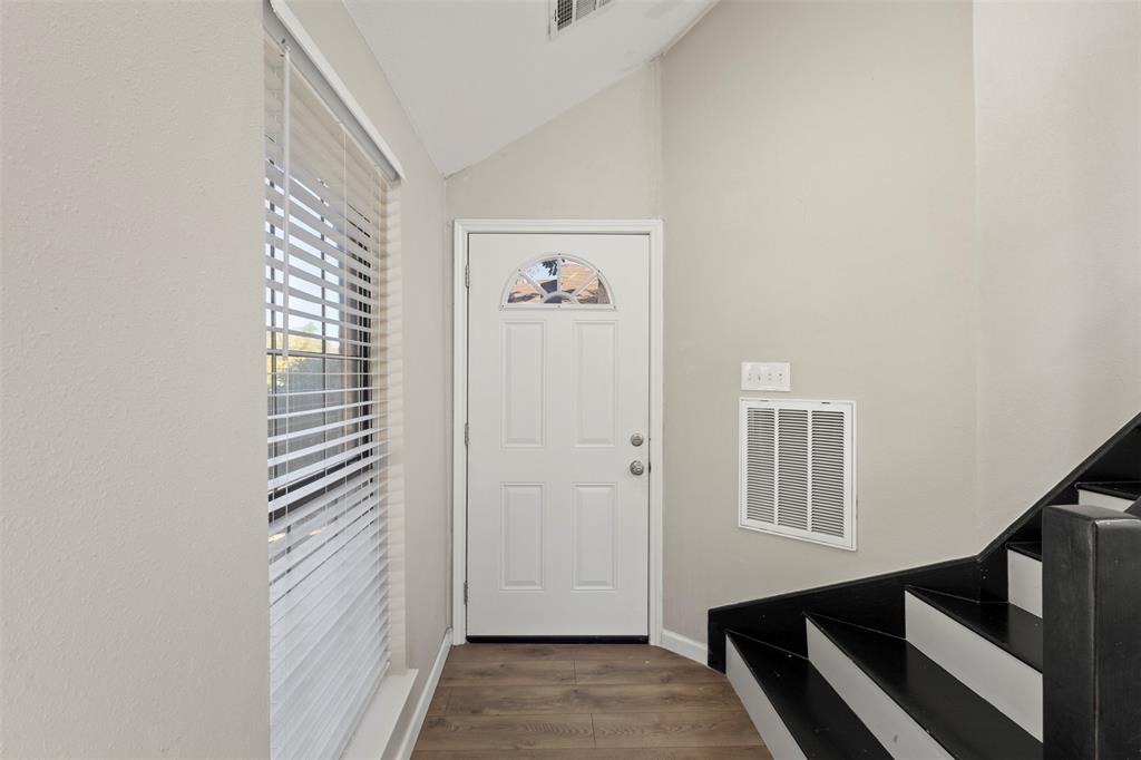 420 Seminary Ridge Mesquite, TX 75149 - Photo 3 of 36 a view of a hallway with entryway and stairs
