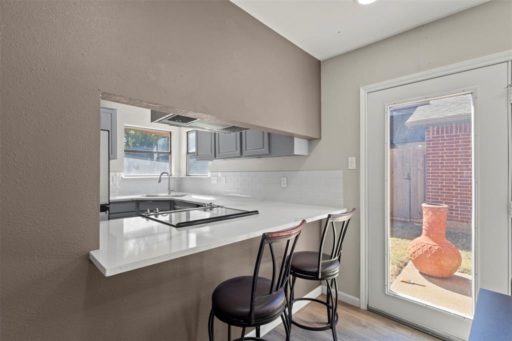 420 Seminary Ridge Mesquite, TX 75149 - Photo 9 of 36 a table and chairs in a kitchen