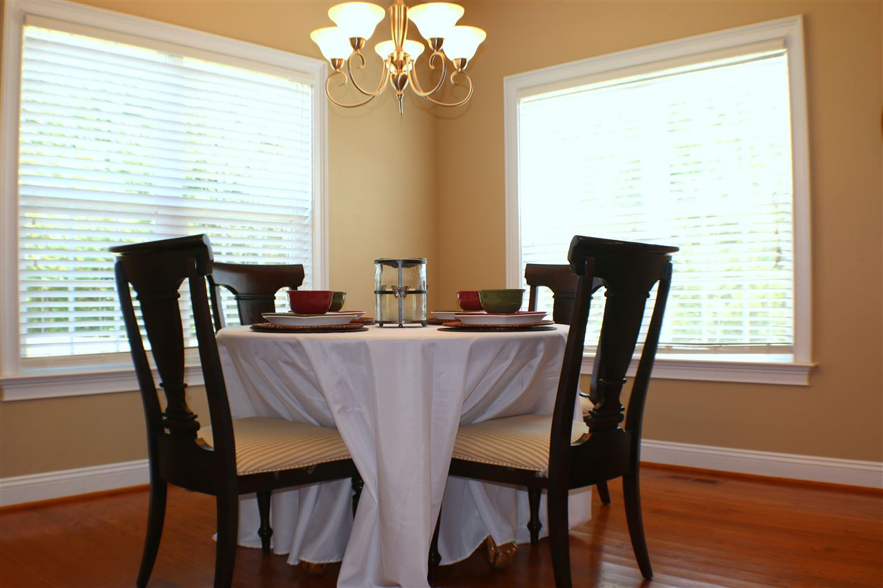 820 Hood Farm Road Clayton, NC 27520 - Photo 17 of 20 Located just off the Updated Kitchen, this breakfast room features HARDWOOD FLOORS, overlooks the large back yard, & access to the SCREENED PORCH. Breakfast Room