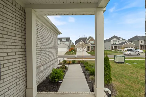 a balcony with a garden and painted walls