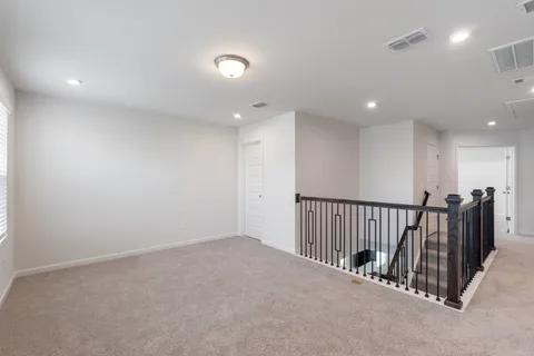 a bedroom with a bed and a table