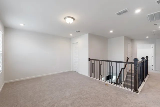 a bedroom with a bed and a table