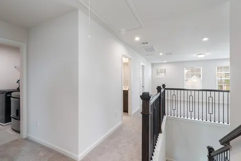 a spacious bedroom with a bed and a table