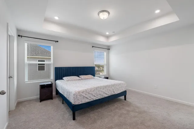 a bathroom with a tub a sink and a mirror