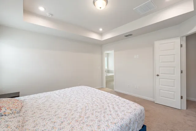 a white bath tub sitting next to a window