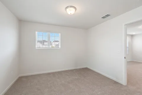 a view of a workspace with furniture
