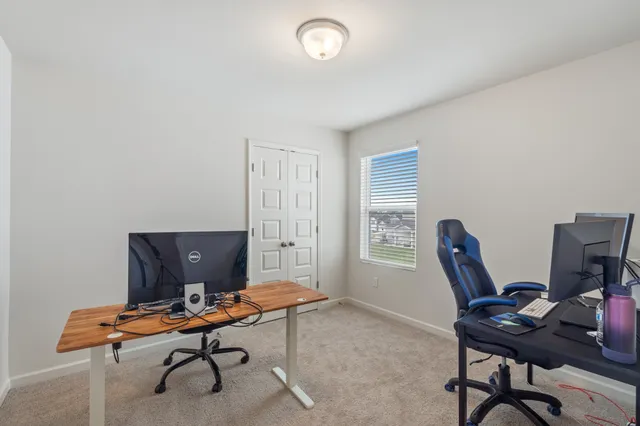 an aerial view of residential houses with outdoor space