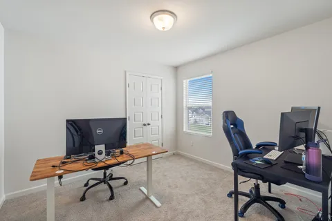 an aerial view of residential houses with outdoor space
