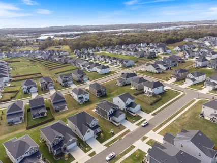 an aerial view of residential houses with outdoor space