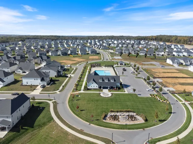 a view of a swimming pool with a yard