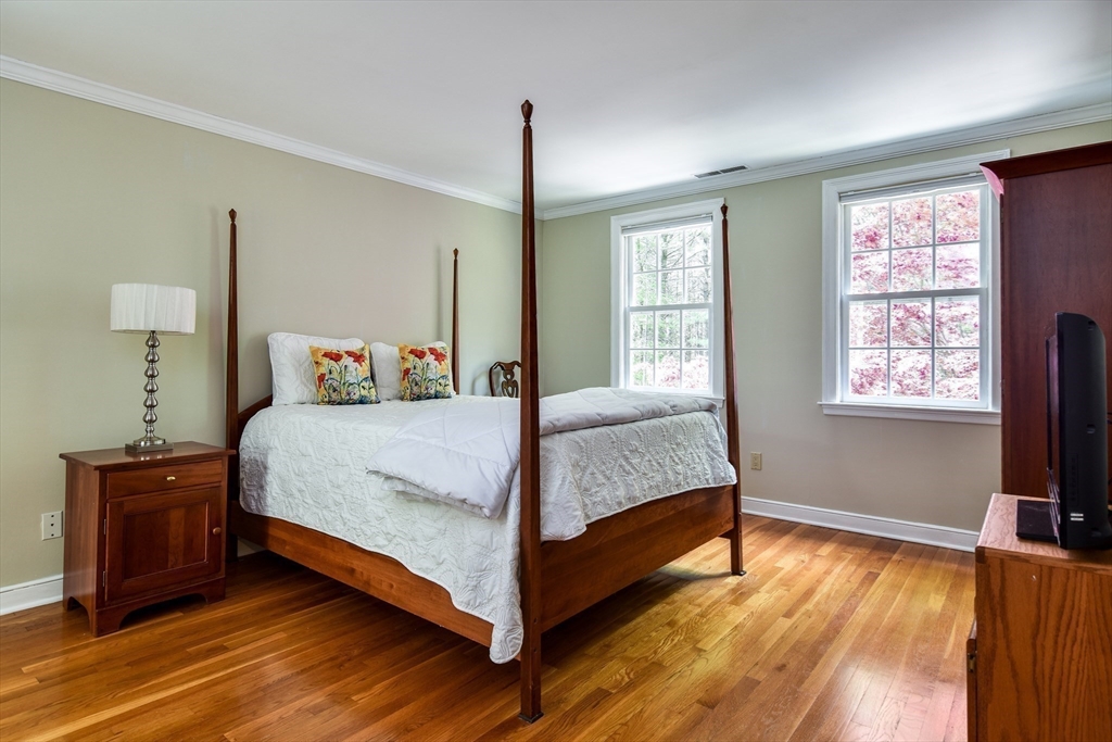 114 Hunters Ridge Road Concord, MA 01742 - Photo 22 of 38 a bedroom with a bed and a window