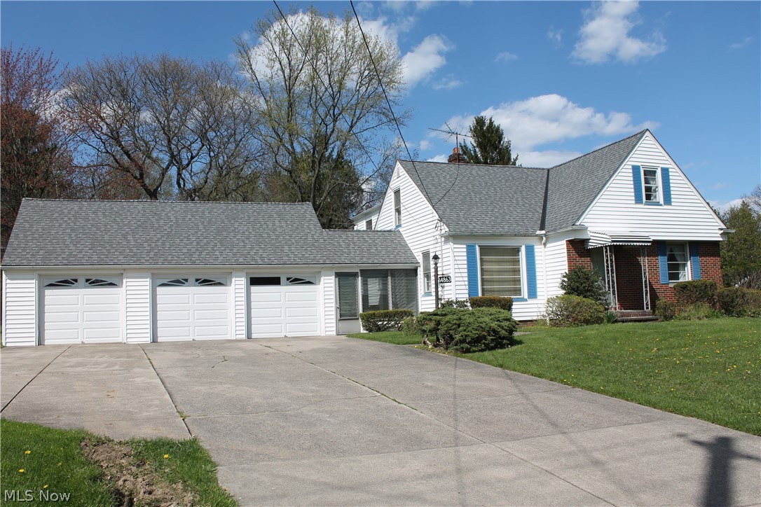 14863 Turney Road Maple Heights, OH 44137 - Photo 34 of 34 View of front of home featuring a 3 car garage and a front yard. Plenty of room to turn around!!