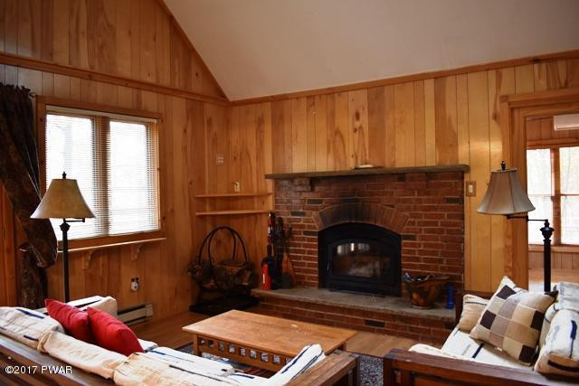 120 Canterbury Road Bushkill, PA 18324 - Photo 8 of 59 a living room with furniture and a fireplace