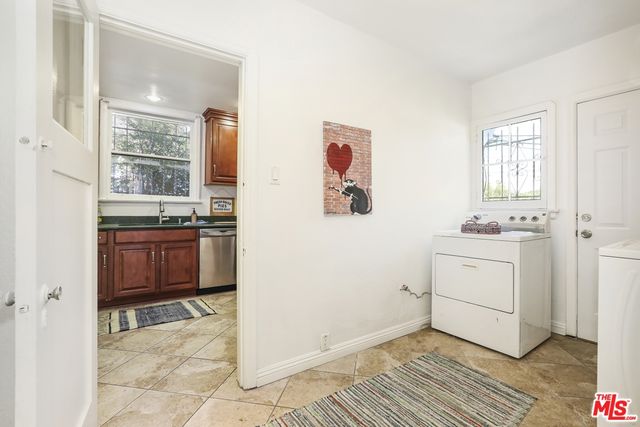a view of a bathroom with a sink and a window