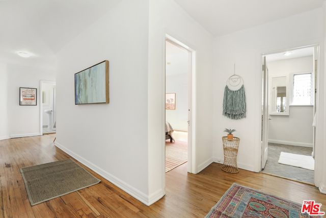 wooden floor in a livingroom with a window