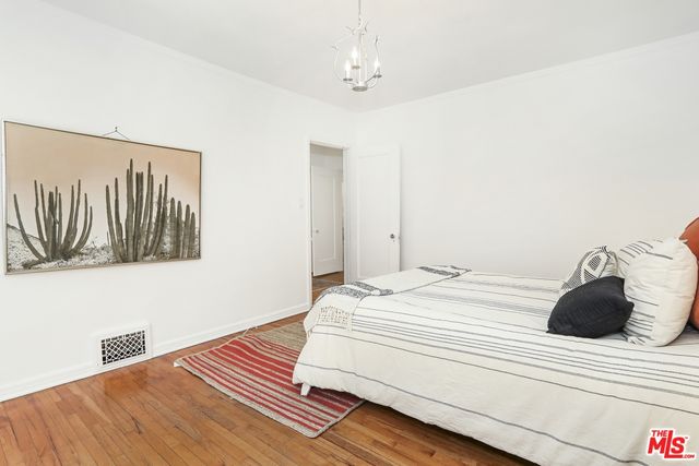 a bedroom with a bed and cabinets