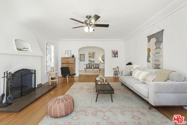 a living room with furniture fireplace and a fireplace