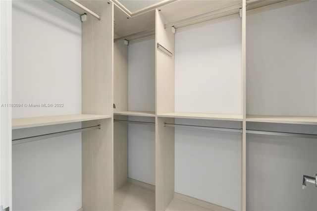 a view of an empty walk in closet