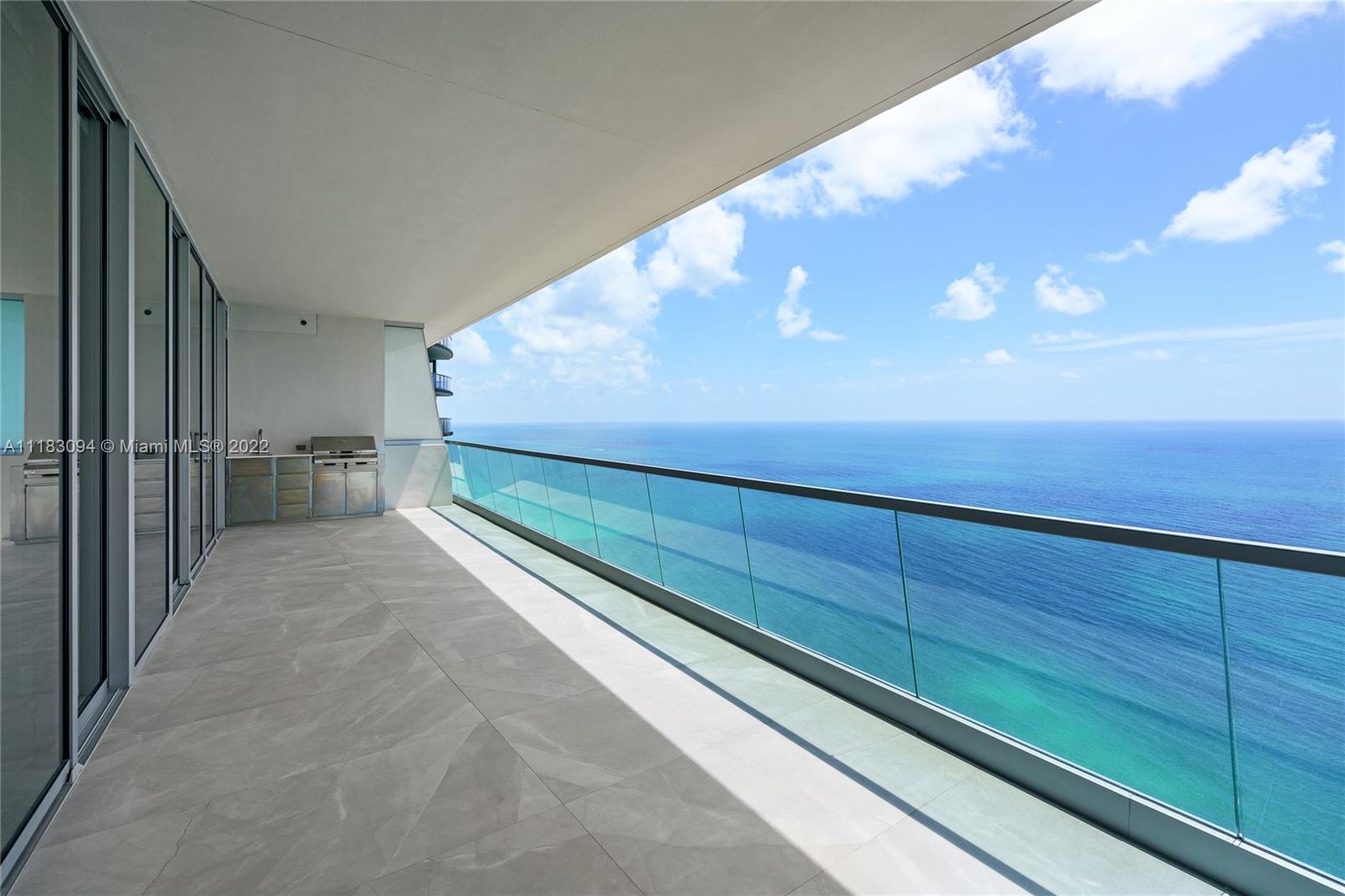 18501 Collins Avenue, Unit 3302 Sunny Isles Beach, FL 33160 - Photo 24 of 48 a view of a room with wooden floor