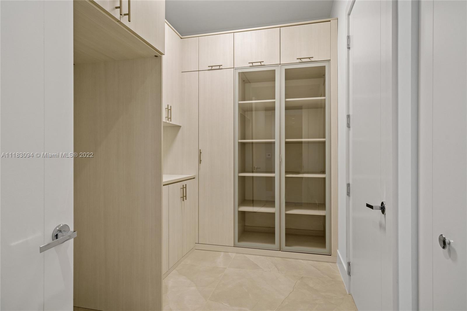18501 Collins Avenue, Unit 3302 Sunny Isles Beach, FL 33160 - Photo 30 of 48 a view of an empty walk in closet