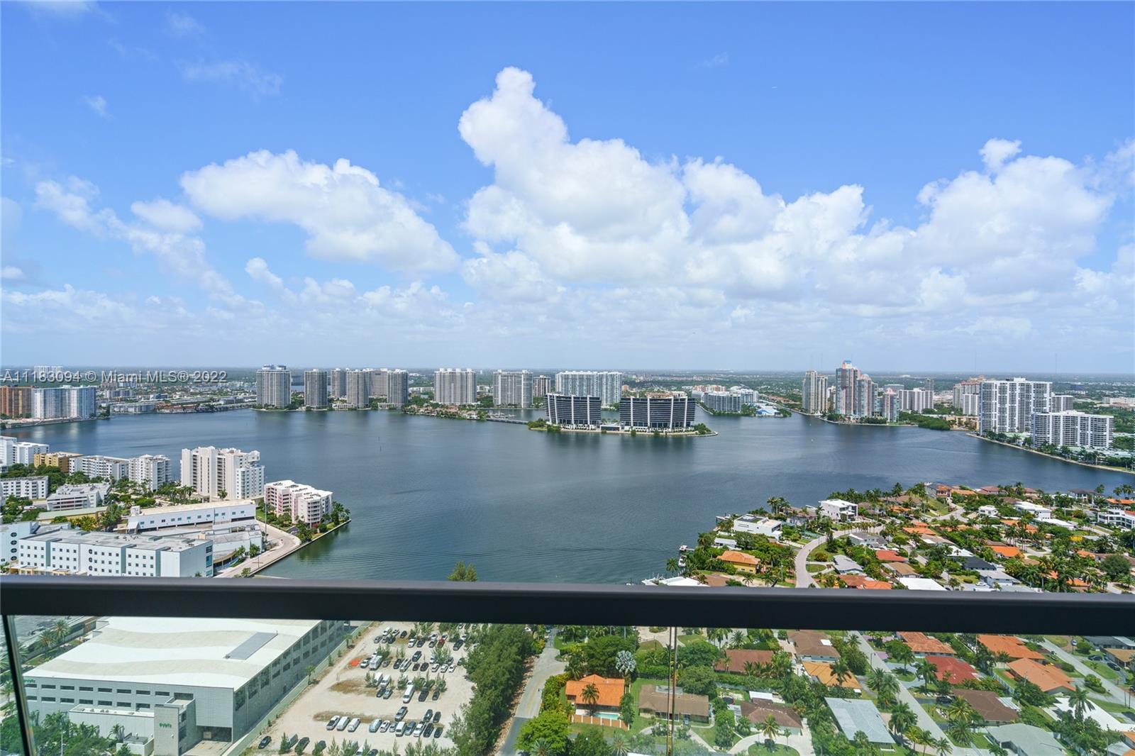 18501 Collins Avenue, Unit 3302 Sunny Isles Beach, FL 33160 - Photo 31 of 48 a view of a lake from a balcony