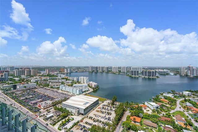 a view of a lake with building in front of it