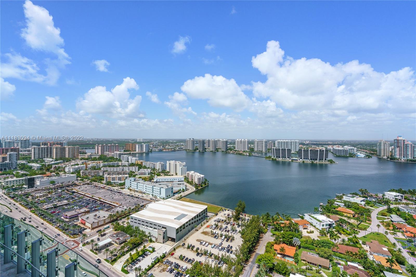 18501 Collins Avenue, Unit 3302 Sunny Isles Beach, FL 33160 - Photo 34 of 48 a view of a lake with building in front of it